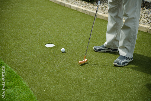 golf mallet on the green, artificial turf