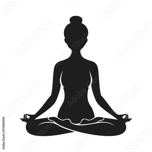 Silhouette of a woman meditating in lotus pose yoga