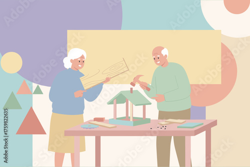 Smiling senior couple building a birdhouse together enjoying a creative DIY hobby at home