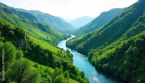 Serpentine river carving through lush green valley, wild, scenic