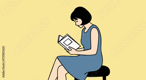 Woman engrossed in reading a book while seated on a stool in a minimalist setting