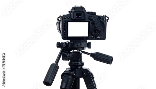 A professional camera mounted on a tripod, back view, with a blank screen, against black