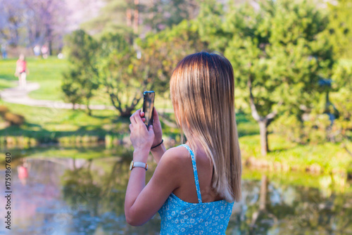 young woman taking a picture of themselves