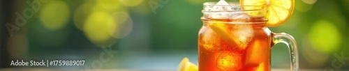 Refreshing iced tea in a mason jar with ice cubes and lemon slices, perfect for a hot summer day Enjoy the cool, crisp beverage , cool, invigorating