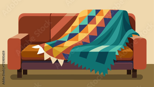 A colorful geometric patterned throw blanket draped over a worn leather couch adorned with fluffy pillows in various patterns.