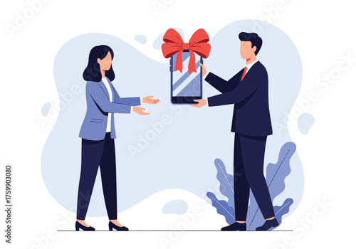 A man in a suit gives a gift wrapped mobile phone to a woman in a business suit.