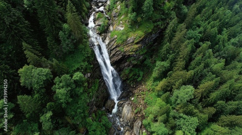 Aerial view of waterfall cascading down rocky cliffs with flowing water, natural landscape, mountain stream and scenic environment isolated on white background
