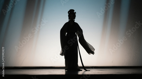 Silhouette of Chinese opera characters, standing in the center of the stage