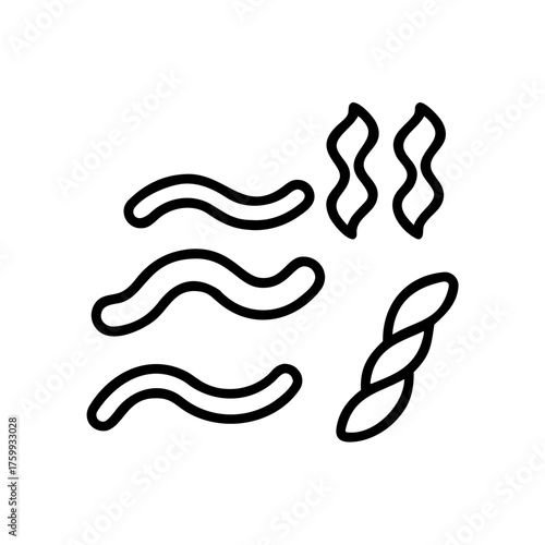 A close up of a black and white cat with green eyes