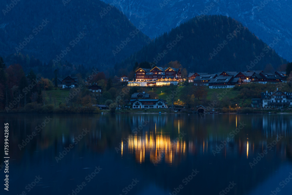 Fototapeta premium The beautiful mountain lake Grundlsee at the southern foot of the Totes Gebirge mountains in the Styrian part of the Salzkammergut in Austria