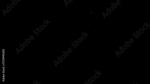 Black background with subtle dust particles specks