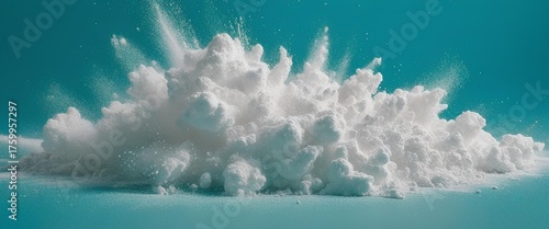 Artistic illustration of a white powder explosion on a blue background.