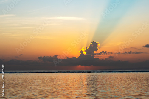 Sun Rays at sunrise in Sanur beach, Bali, Indonesia