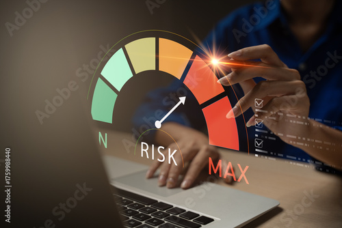 Business risk management concept with risk level indicator on virtual screen. A professional hand analyzing high risk on digital dashboard, suitable for finance, insurance, or investment content.