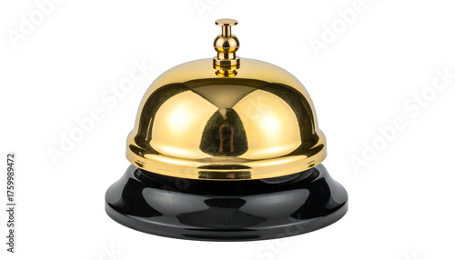 Shiny, golden bell atop a black base, reflecting light against a black background