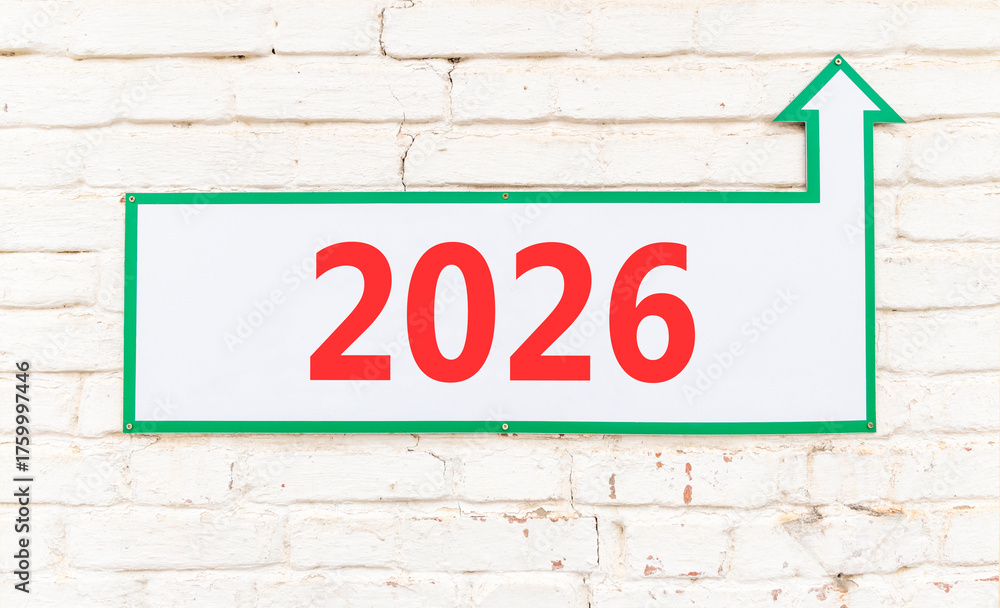 Obraz premium Business concept of 2026 new year symbol. Concept number 2026 Happy new year on beautiful white road sign. Beautiful old white brick wall background. Business 2026 happy new year concept. Copy space.