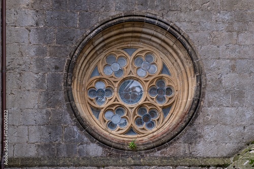 Gothic Stone Oculi Window and Tracery on the Exterior Wall of a Historical Basilica of Lekeitio