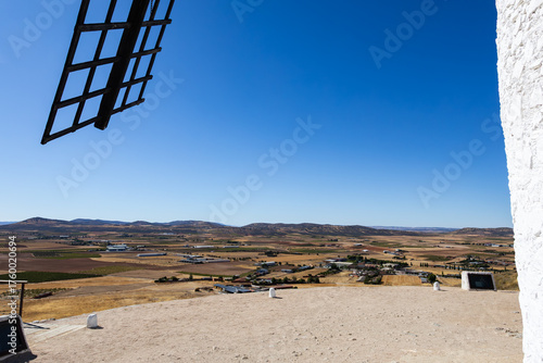 Consuegra windmill blade framing La Mancha landscape