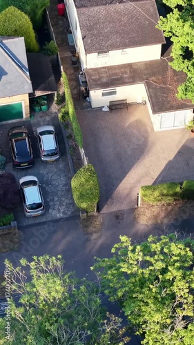 Drone moving above trees and revealing residential neighborhood
