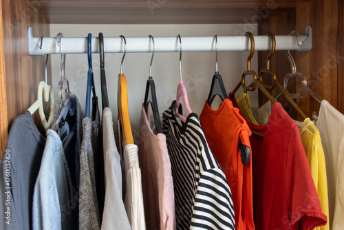 Various clothes hanging in the wardrobe