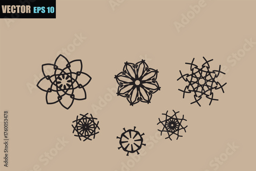 Intricate geometric floral ornaments and snowflakes in a decorative arrangement on a neutral background