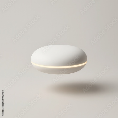 Futuristic white smart device with soft glowing light on neutral background