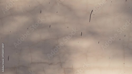 Seamless loop textured surface with subtle cracks and a soft, cloudy pattern texture background
