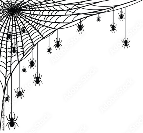 Spooky corner decoration featuring a large cobweb with many hanging spiders for halloween