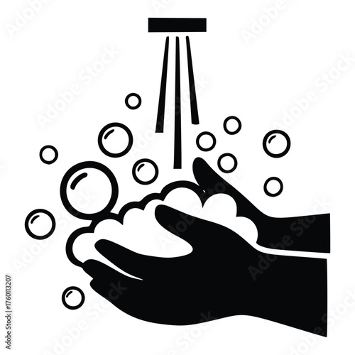 Hands washing with soap and water under a faucet.