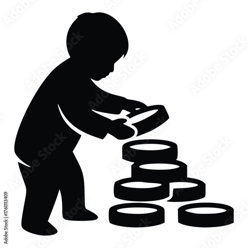 Silhouette of a young child playing with stacking rings toy.