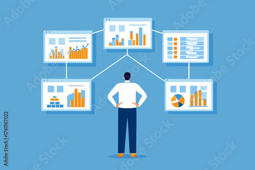 Businessman analyzing multiple data charts and graphs on screens connected to him
