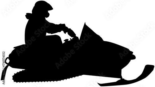 Silhouette of a person riding a snowmobile in the snow