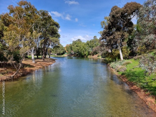 Burra Creek lined with Australian gum trees under a beautiful blue sky
