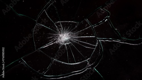 Broken cracks glass fracture effect on black background, Glass crack spreading across,
Shattered glass animated overlay, transparent 4K video, Shattered Glass: Dynamic Cracks and Splinters.