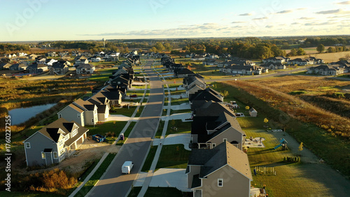 Building residential neighborhood. Aerial view of new construction houses. Establishing shot of Midwestern United States.