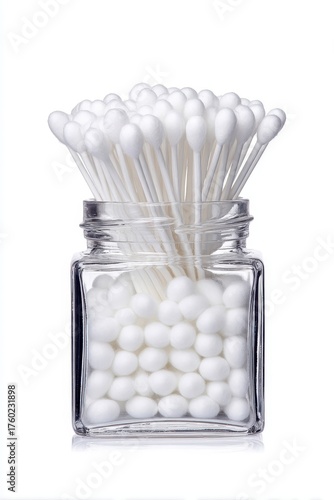A glass jar filled with white marsh sticks