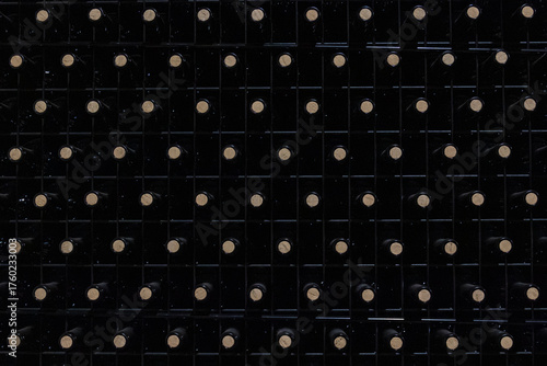 Vintage Grid: a highly geometric and repetitive photograph of the bottles arranged in perfectly aligned rows and columns