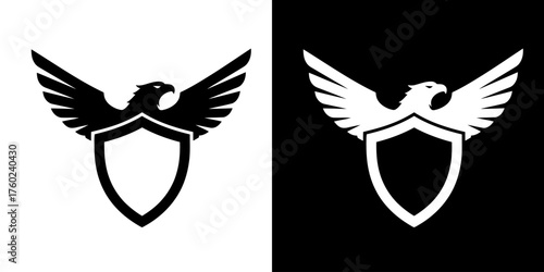 A black and white graphic of an eagle with outstretched wings perched on a shield.