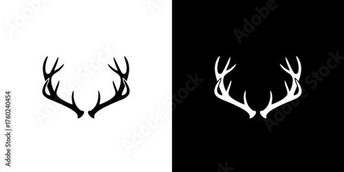 A minimalist graphic design featuring a pair of black deer antlers on a white background and a pair of white deer antlers on a black background.