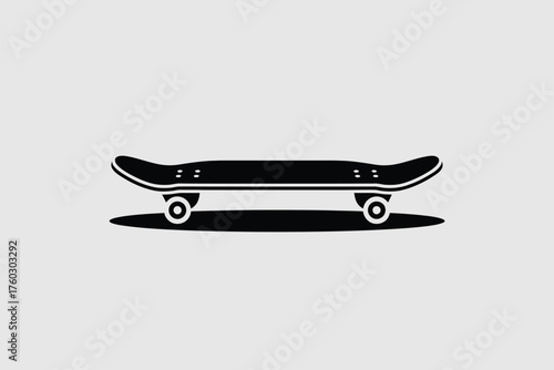 Black skateboard with wheels on grey background white transportation