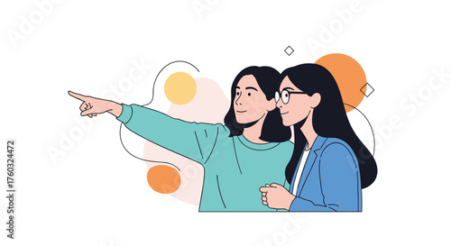 Two young women pointing to the distance together.