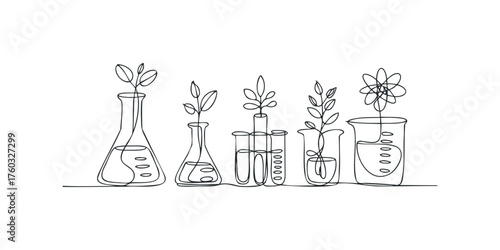 Laboratory glassware with growing plant sprouts