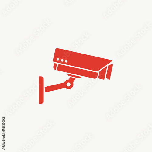 Red security camera icon mounted on a wall, symbolizing surveillance, safety, and monitoring in a minimalist graphic style.