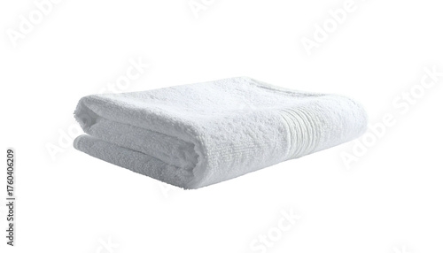 Folded, pristine white towel isolated against a stark black backdrop