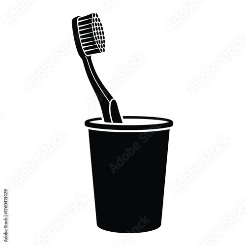 Black toothbrush in cup hygiene dental care