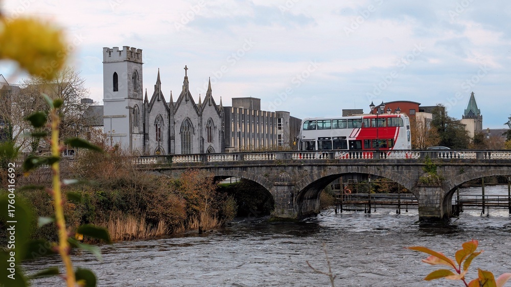 Obraz premium Beautiful Galway City River Corrib Bridge View with Historic Cathedral and Church Architecture, Ireland Travel Destination, European Tourism Landmark