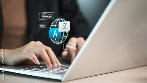 Fotografija Online Translation and Localization on Laptop with Global Language Icons