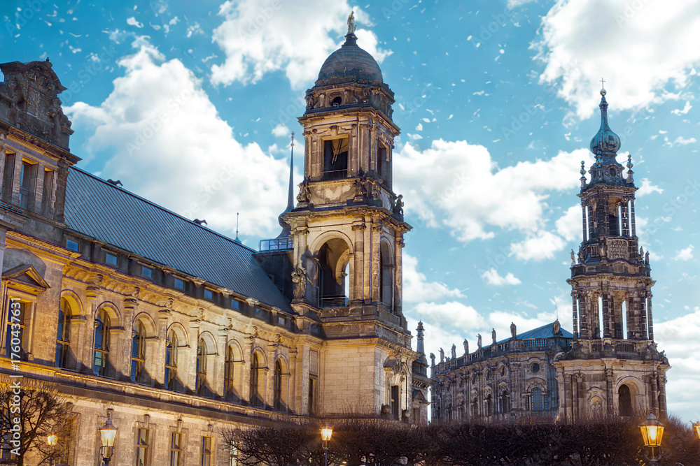 Naklejka premium Historic european architecture with tall spires under a cloudy sky