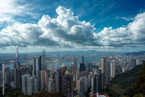 Vast cityscape under dramatic clouds and blue sky