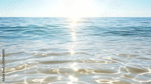 Gentle waves reflecting sunlight create tranquil ocean scene, evoking peace and serenity